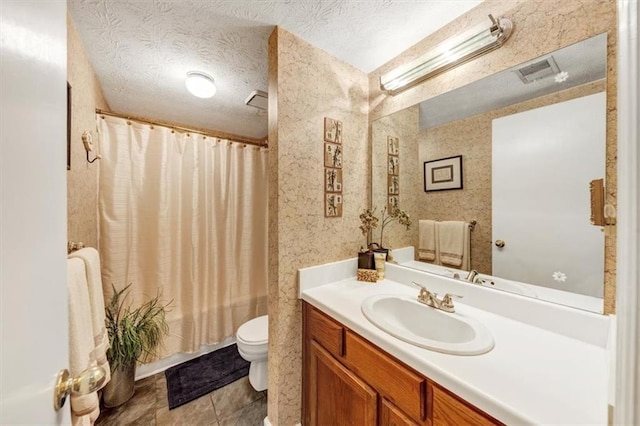 bathroom featuring toilet, vanity, a textured ceiling, and shower / bath combination with curtain