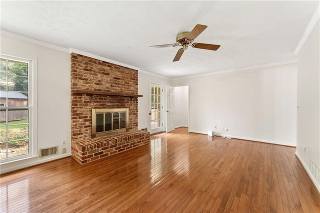 4135 Shoshone Valley Rd, Marietta, GA 30068 - unfurnished living room featuring hardwood / wood-style floors, a brick fireplace, ornamental molding, and a ceiling fan