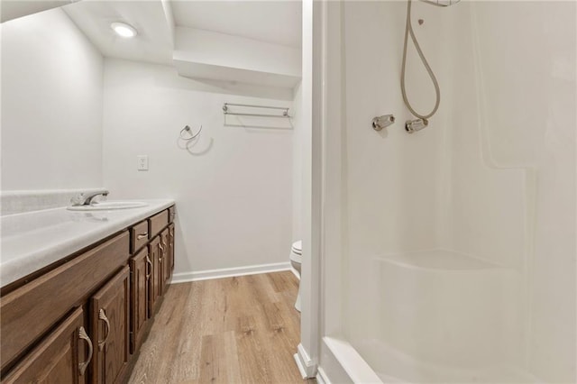 4135 Shoshone Valley Rd, Marietta, GA 30068 - full bath featuring wood finished floors, vanity, and a shower