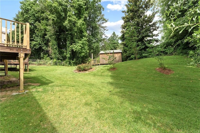 4135 Shoshone Valley Rd, Marietta, GA 30068 - view of green lawn featuring a storage shed and a deck