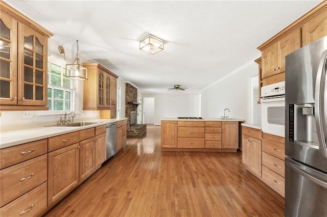 4135 Shoshone Valley Rd, Marietta, GA 30068 - kitchen with stainless steel appliances, wood finished floors, decorative light fixtures, glass insert cabinets, and ceiling fan