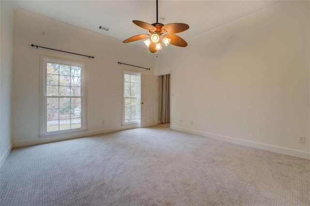 carpeted empty room with ceiling fan