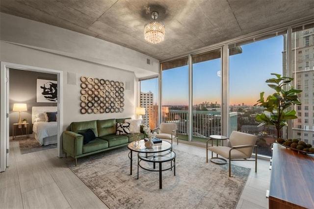 living room with floor to ceiling windows and a notable chandelier