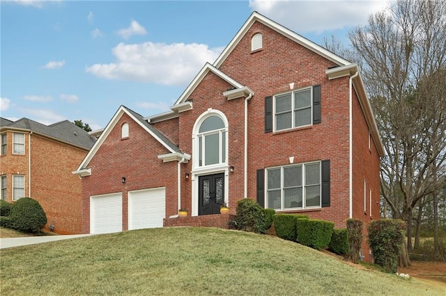 traditional home featuring a front lawn, concrete driveway, french doors, and brick siding