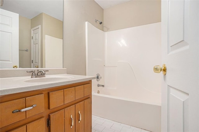 bathroom with tile patterned flooring, vanity, and shower / bathing tub combination