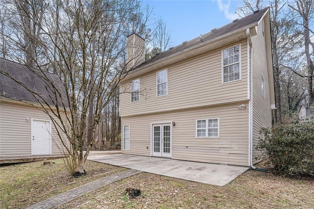 back of house featuring a patio area and french doors