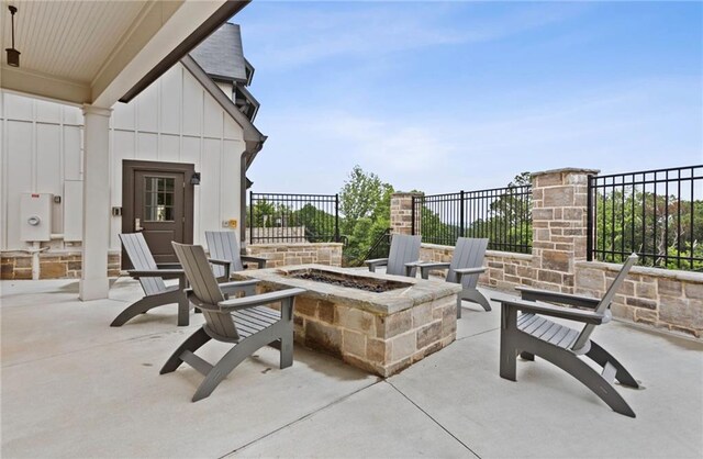 view of patio / terrace featuring a fire pit