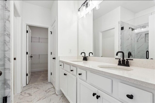 bathroom with vanity and an enclosed shower