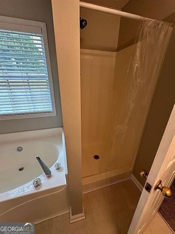 929 Wexford Way, Auburn, GA 30011 - bathroom with a bath and curtained shower