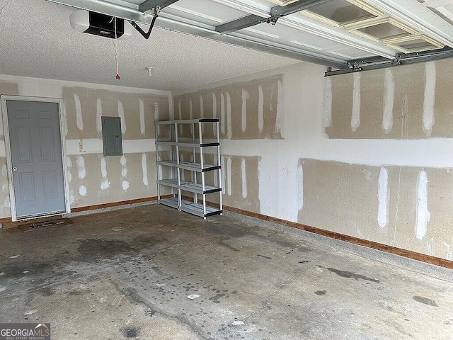 929 Wexford Way, Auburn, GA 30011 - garage with electric panel, a garage door opener, and baseboards