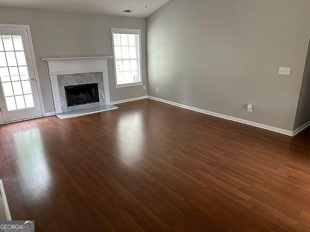929 Wexford Way, Auburn, GA 30011 - unfurnished living room with dark wood-style floors, baseboards, and a fireplace