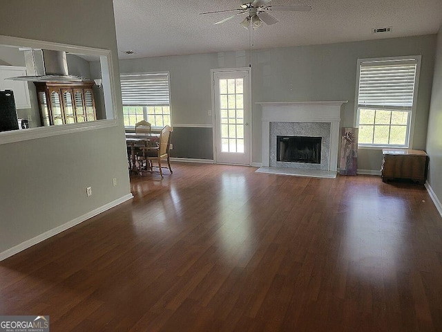 929 Wexford Way, Auburn, GA 30011 - living room with ceiling fan, plenty of natural light, wood finished floors, and a textured ceiling