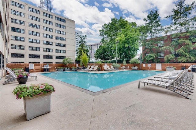 view of swimming pool with a patio