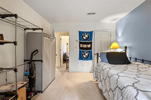 bedroom featuring light colored carpet