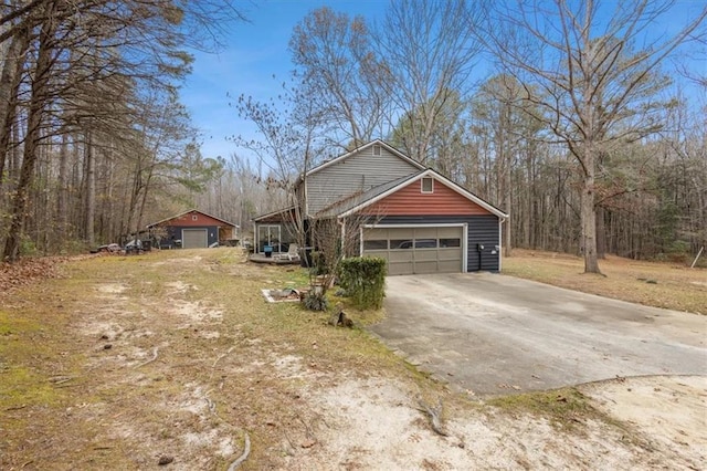 view of side of home featuring a garage