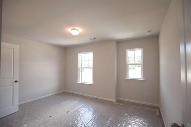 unfurnished room featuring a healthy amount of sunlight