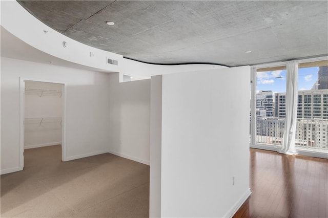 unfurnished room featuring wood-type flooring