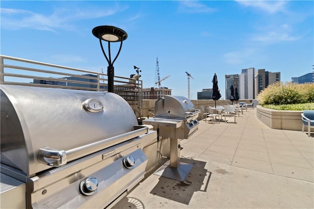 view of patio with an outdoor kitchen and grilling area