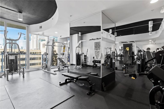 gym featuring floor to ceiling windows