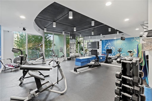 gym featuring floor to ceiling windows