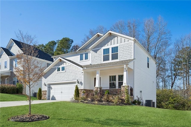 craftsman-style house featuring a front yard, a porch, central AC, and a garage