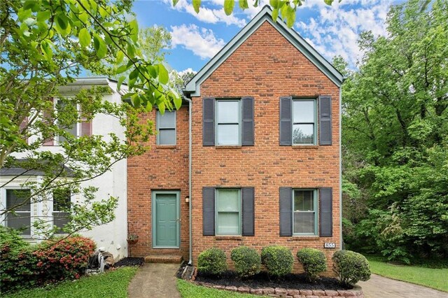 view of front of home with brick siding