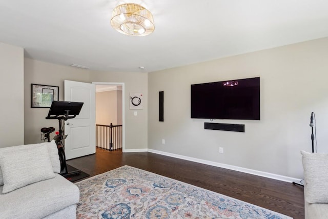 living area featuring wood finished floors and baseboards