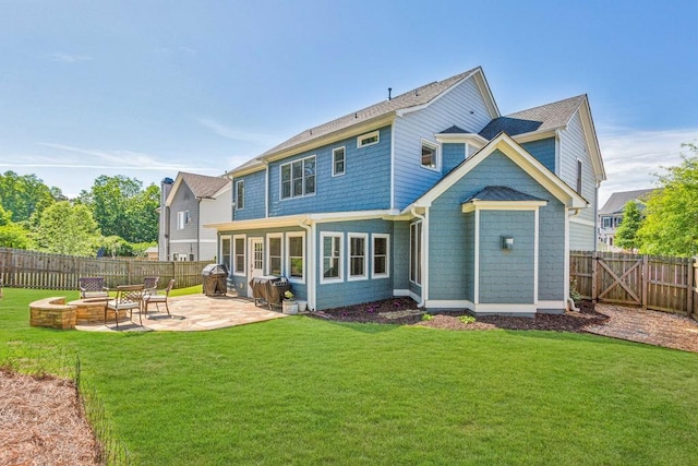 rear view of property featuring a patio area