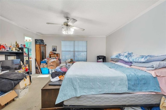 carpeted bedroom featuring a textured ceiling, ceiling fan, and ornamental molding