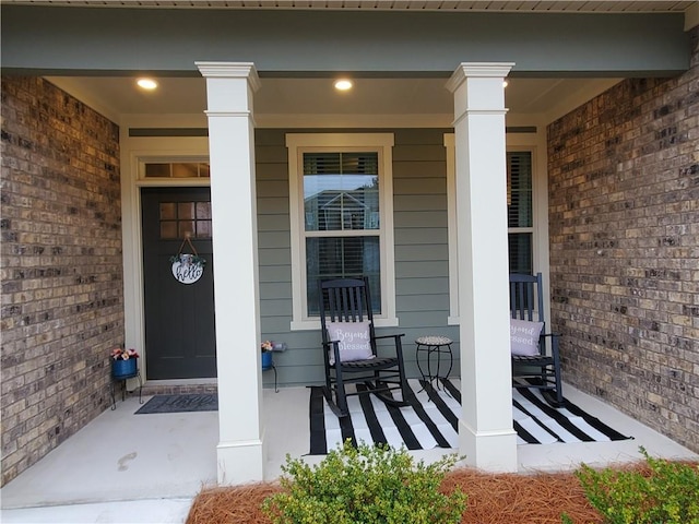 entrance to property featuring covered porch