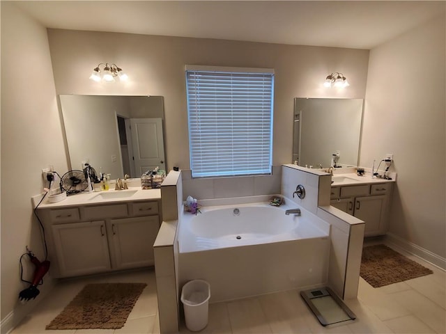 bathroom with a washtub and vanity