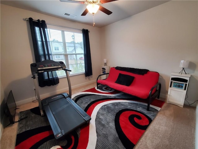 interior space with carpet and ceiling fan