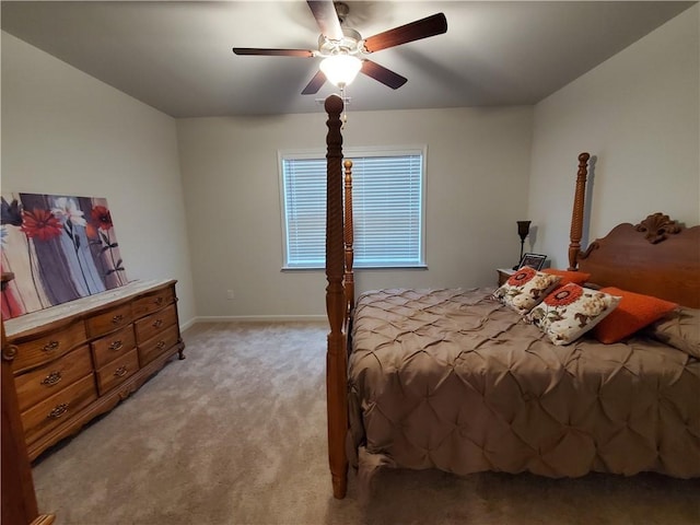 bedroom with light carpet and ceiling fan