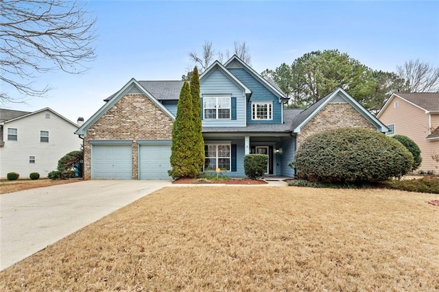 view of front of house with a garage and a front yard