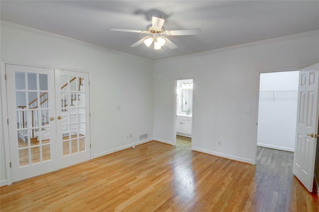 5404 Chaversham Ln, Peachtree Corners, GA 30092 - spare room featuring a ceiling fan, light wood finished floors, ornamental molding, and baseboards