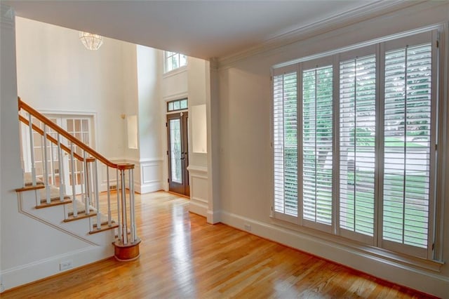 5404 Chaversham Ln, Peachtree Corners, GA 30092 - entrance foyer featuring wood finished floors, stairs, ornamental molding, a chandelier, and baseboards