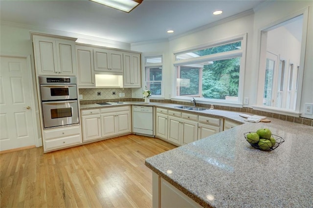 5404 Chaversham Ln, Peachtree Corners, GA 30092 - kitchen with white appliances, crown molding, a sink, plenty of natural light, and light wood-style flooring