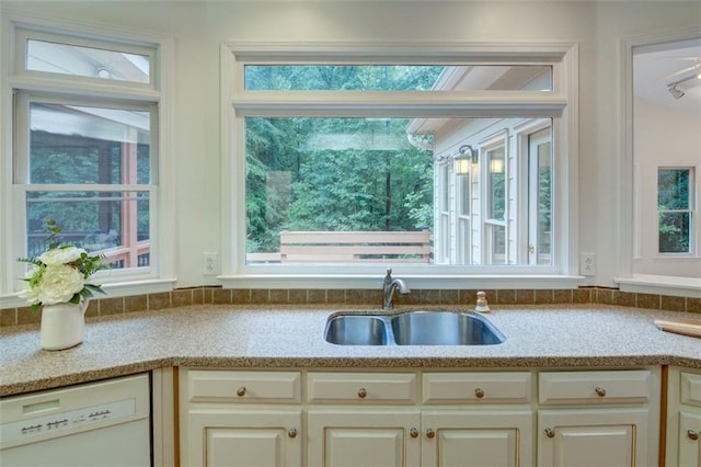 5404 Chaversham Ln, Peachtree Corners, GA 30092 - kitchen featuring dishwasher, a sink, and light stone counters