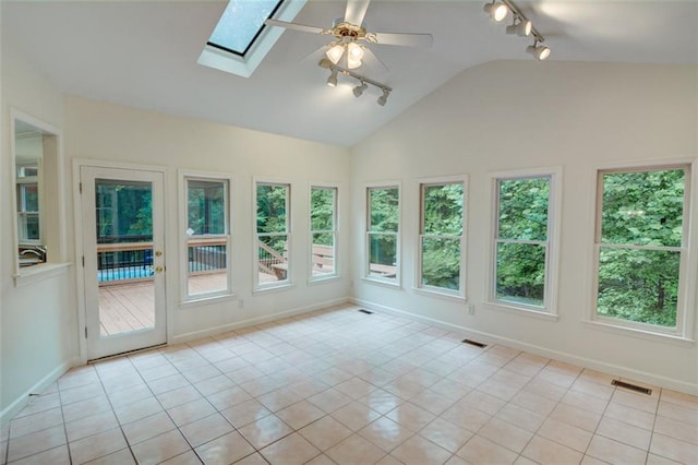 5404 Chaversham Ln, Peachtree Corners, GA 30092 - unfurnished sunroom featuring track lighting, vaulted ceiling, a skylight, baseboards, and tile patterned flooring