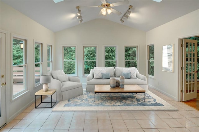 5404 Chaversham Ln, Peachtree Corners, GA 30092 - living room featuring rail lighting, lofted ceiling, plenty of natural light, and baseboards