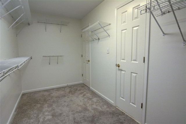 5404 Chaversham Ln, Peachtree Corners, GA 30092 - walk in closet featuring carpet