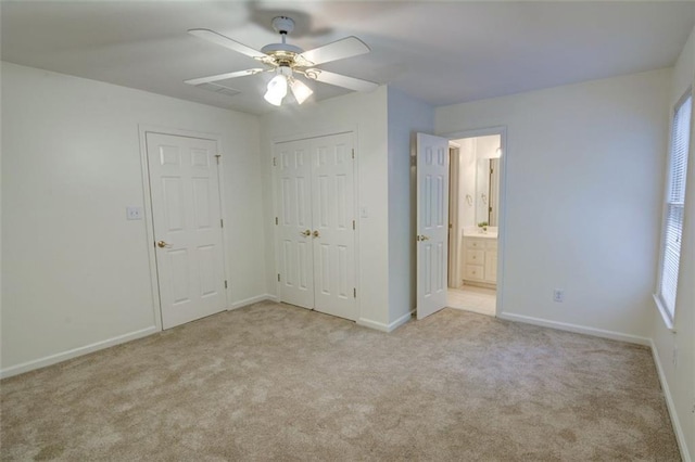 5404 Chaversham Ln, Peachtree Corners, GA 30092 - unfurnished bedroom with carpet floors, baseboards, a closet, ceiling fan, and connected bathroom