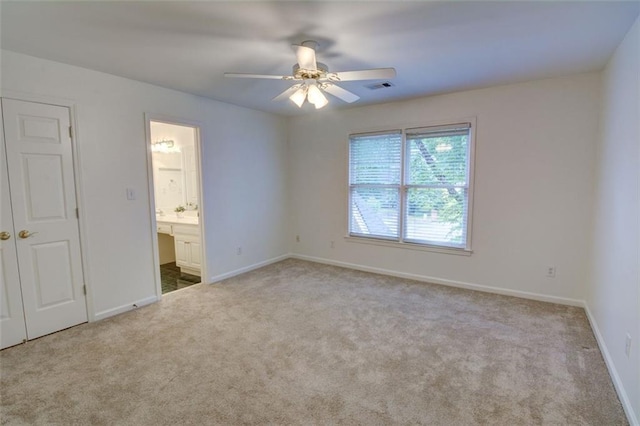 5404 Chaversham Ln, Peachtree Corners, GA 30092 - unfurnished bedroom featuring carpet floors, baseboards, connected bathroom, and ceiling fan