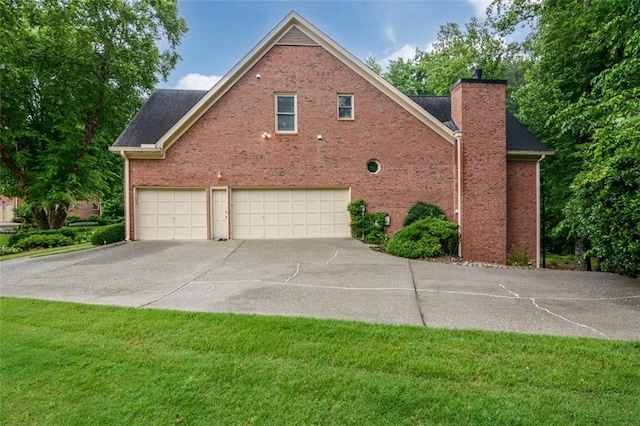 5404 Chaversham Ln, Peachtree Corners, GA 30092 - view of side of home featuring an attached garage, concrete driveway, a chimney, brick siding, and a yard