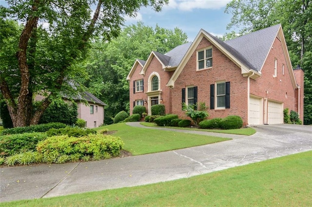 5404 Chaversham Ln, Peachtree Corners, GA 30092 - view of front of property featuring brick siding, concrete driveway, and a front lawn