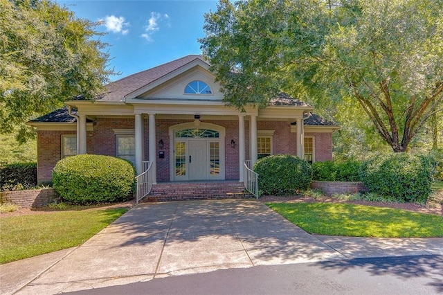 5404 Chaversham Ln, Peachtree Corners, GA 30092 - view of front facade with a porch, brick siding, and a front lawn