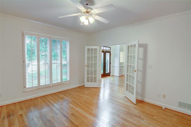 5404 Chaversham Ln, Peachtree Corners, GA 30092 - spare room featuring french doors, ornamental molding, light wood-type flooring, and baseboards