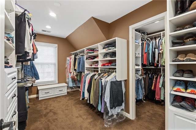 walk in closet with dark carpet and visible vents