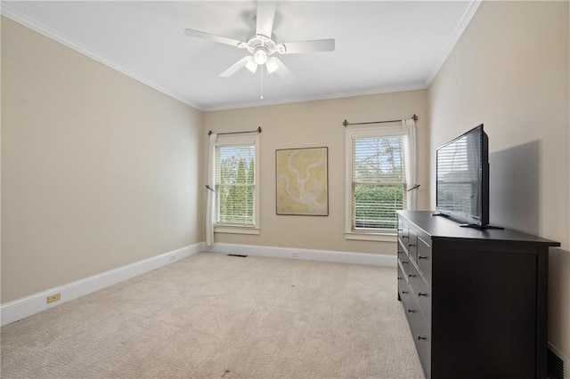 office featuring a healthy amount of sunlight, ornamental molding, and light colored carpet