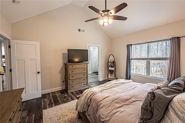 bedroom featuring baseboards, visible vents, dark wood finished floors, ceiling fan, and high vaulted ceiling